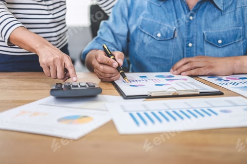 Preview: Business Team Collaborating on Financial Data Analysis