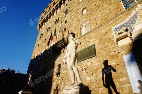 Preview: Statue of David in front of the Accademia Gallery in Florence under the sunlight