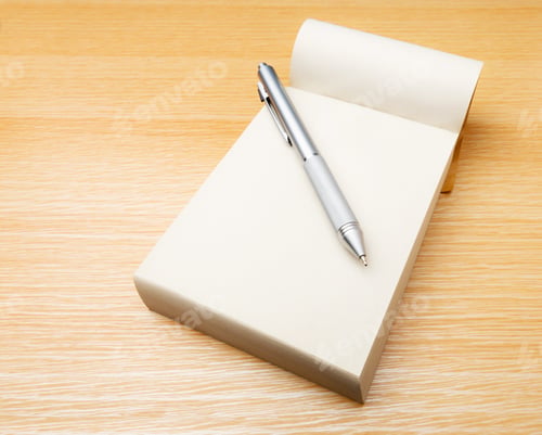 Preview: Memo pad and pen on the table