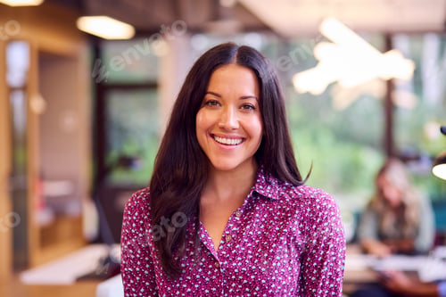Preview: Portrait Of Smiling Businesswoman Standing In Modern Open Plan Office