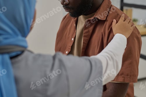 Preview: Muslim Doctor Consoling Her African American Patient