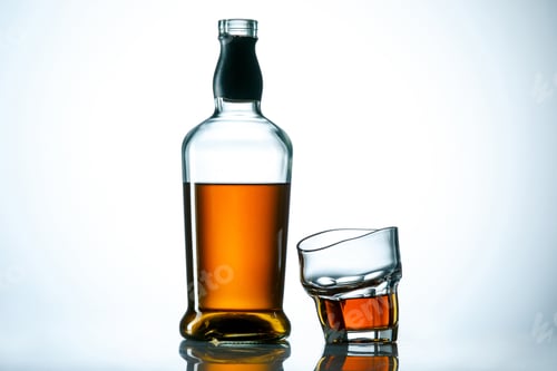 Preview: The curved glass of whiskey or alcohol drink