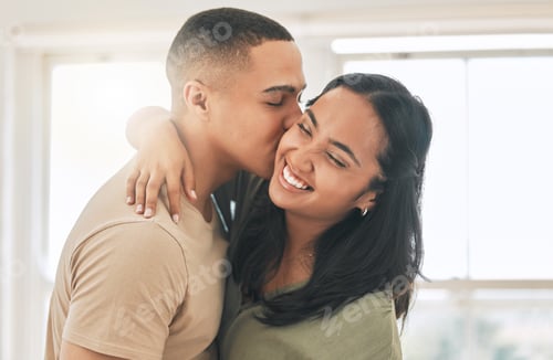 Preview: Young love. Cropped shot of an affectionate young couple at home.