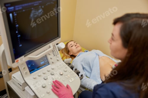 Preview: Gynecologist making ultrasonic diagnostic test for patient