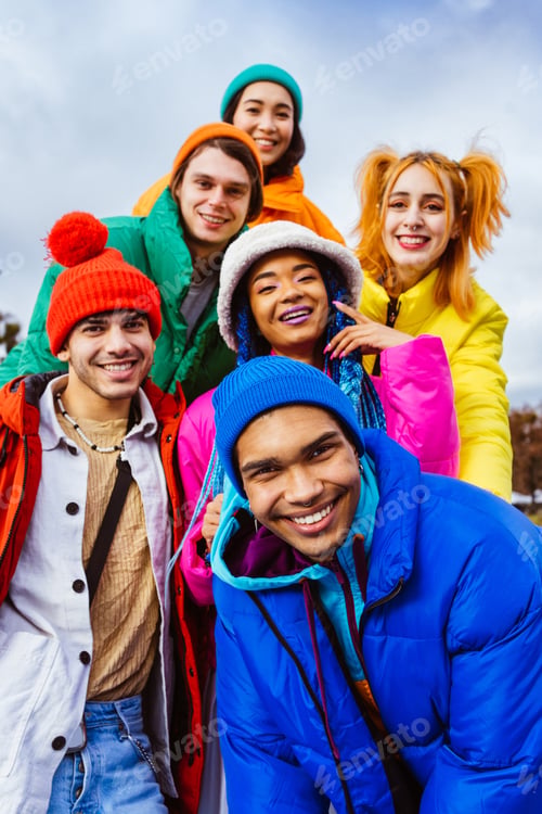 Preview: Multiracial group of young friends meeting outdoors in winter