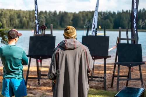 Preview: Painters enjoying the view of a lake in Russia with blank canvases on stands