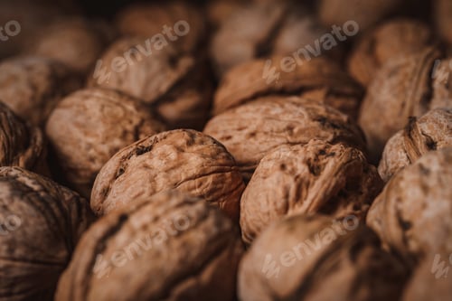 Preview: full frame of tasty walnuts as background
