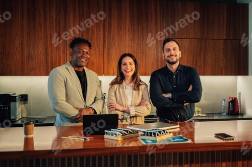 Preview: Portrait of diverse team of environmentalists smiling at camera at office