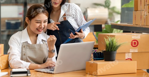 Preview: small businesses SME owners female entrepreneurs and friend excited and celebrating while working