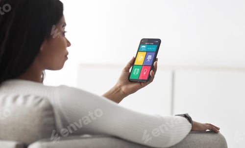 Preview: Smart house app on smartphone in black woman hands, closeup