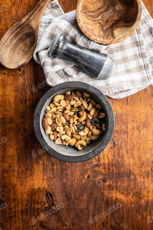 Preview: Close Up of Nuts and Wooden Utensils