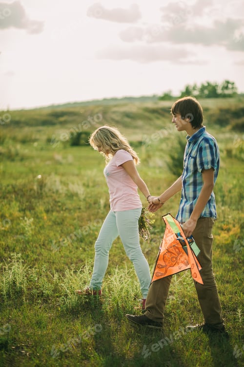 Preview: lovely couple walk at green meadow