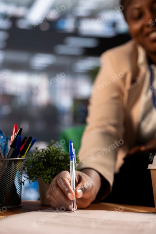 Preview: Multicultural team of female leaders in a corporate meeting sign an agreement