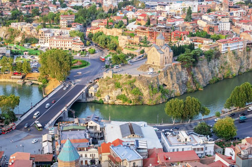 Preview: Tbilisi, Georgia - September 22, 2022: Panoramic view of city center with bank of Kura River.