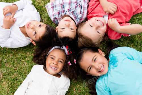 Preview: Happy Group Of Kids Lying On The Floor In A Circle