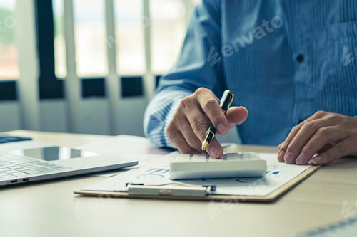 Preview: Close up account man hand using calculator for calculate and writing make a note with pen, financial