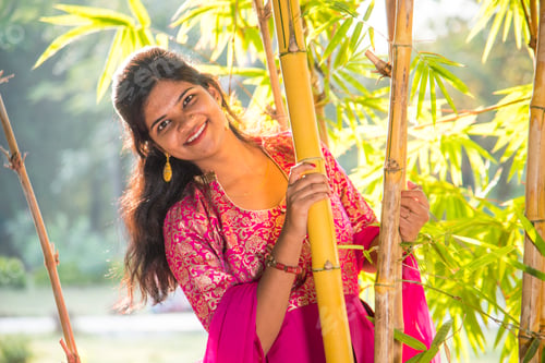 Preview: Happy smiling girl in bamboo forest.
