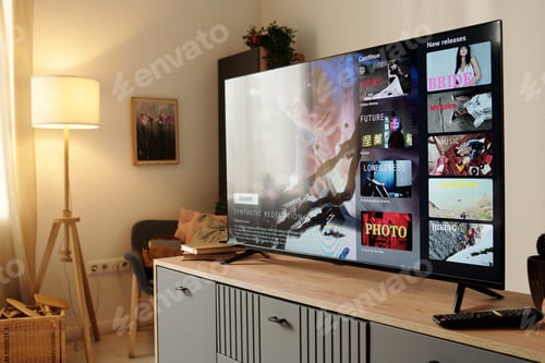 Preview: Viewing Entertainment on Modern Flat-Screen TV in Cozy Room