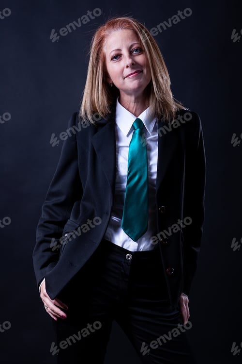 Preview: Woman Posing in Black Suit with Teal Tie