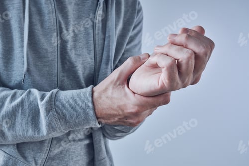 Preview: Rheumatoid arthritis, man suffering from severe pain in wrist