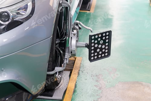 Preview: Closeup Car wheel clamp with wheel align device for alignment