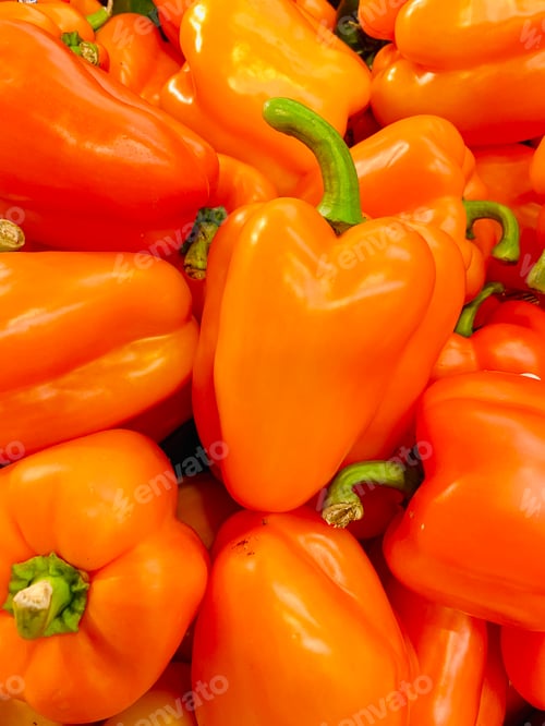 Preview: Orange bell peppers in a pile or a group