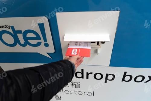 Preview: Point of view putting election ballot envelope into a drop box.