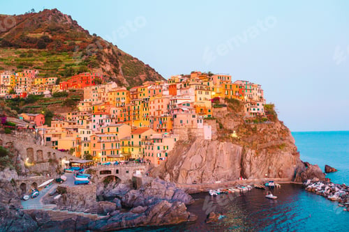 Preview: Stunning view of the beautiful and cozy village of Manarola in the Cinque Terre Reserve at sunset