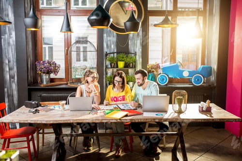 Preview: Group of people working together in the cafe