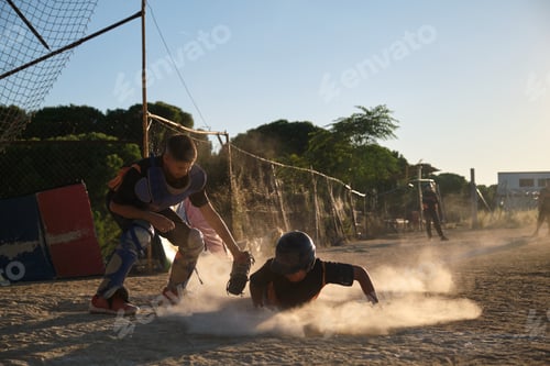 Preview: Kids playing baseball, sliding on a dusty field