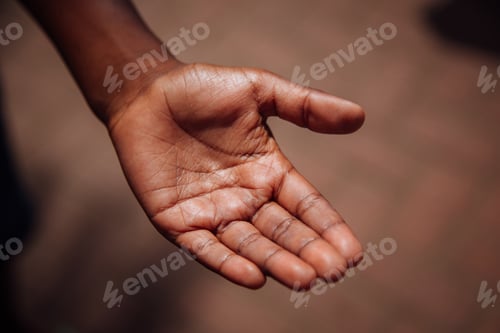 Preview: High angle shot of a man open palm