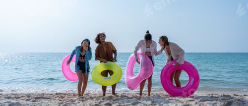 Preview: Group of diverse young women smiling on a sunny beach. Youth Friends Enjoying Sea Splash Together.