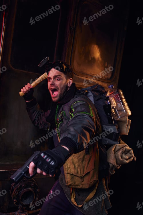 Preview: screaming man armed with axe and gun defending in abandoned subway, post-apocalyptic survival