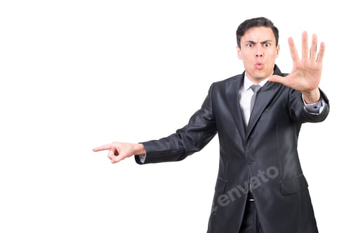 Preview: Serious Man in Suit Gesturing to the Side