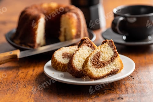 Preview: Sweet sponge cake. Bundt cake on wooden table.