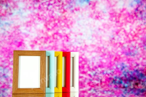 Preview: front view different picture frames with colored corners on light pink background color picture