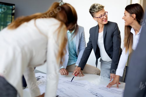 Preview: Group of architects and business people working together and brainstorming