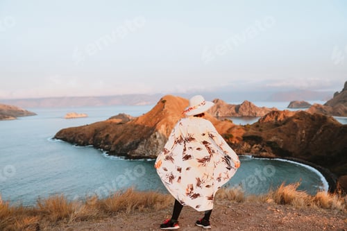 Preview: Woman tourist at top hills