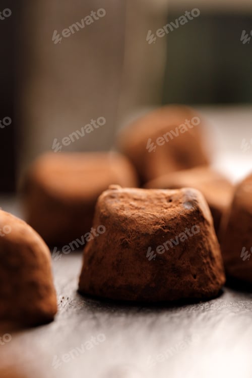 Preview: Chocolate truffel candy on black surface close up
