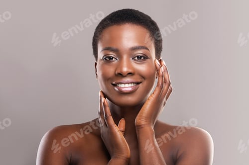 Preview: Smiling Woman Posing with Hands on Face