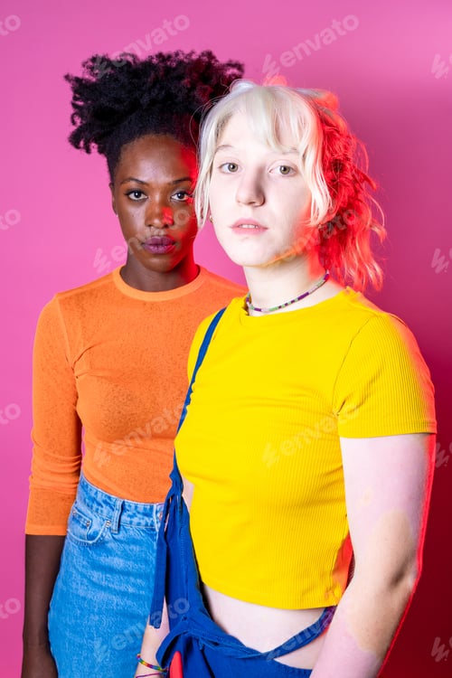 Preview: Isolated caucasian and black woman posing together for inclusion and tolerance isolated background