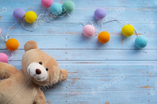 Preview: Flat lay of a teddy bear on wooden table