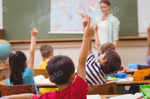 Preview: Pupils Raising Hand During Geography Lesson In Classroom At The Elementary School