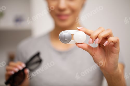 Preview: Contact Eye Lens, Closeup Of Woman Hands Holding White Eyelense Container.