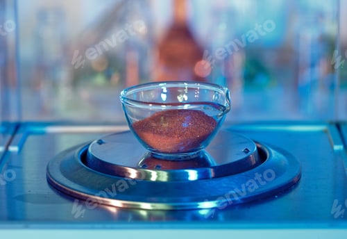 Preview: Close-up of a chemical substance being weighed in a laboratory setting