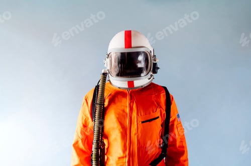 Preview: Unrecognizable man in orange astronaut suit