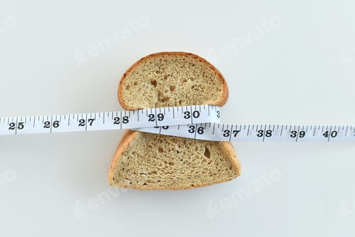 Preview: Bread Slice Wrapped With Measuring Tape on White