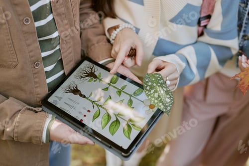 Preview: Unrecognizable Teenagers Studying Plants