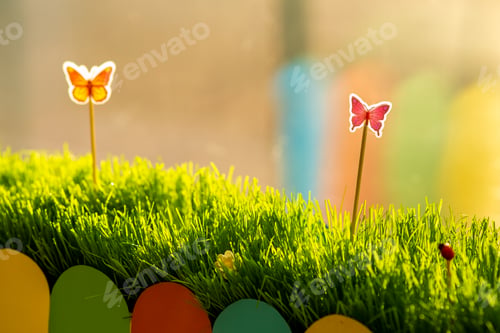 Preview: Close up of small green grass with special cute toys small butterflies. Concept of beautiful plants