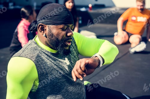 Preview: People exercising at fitness gym
